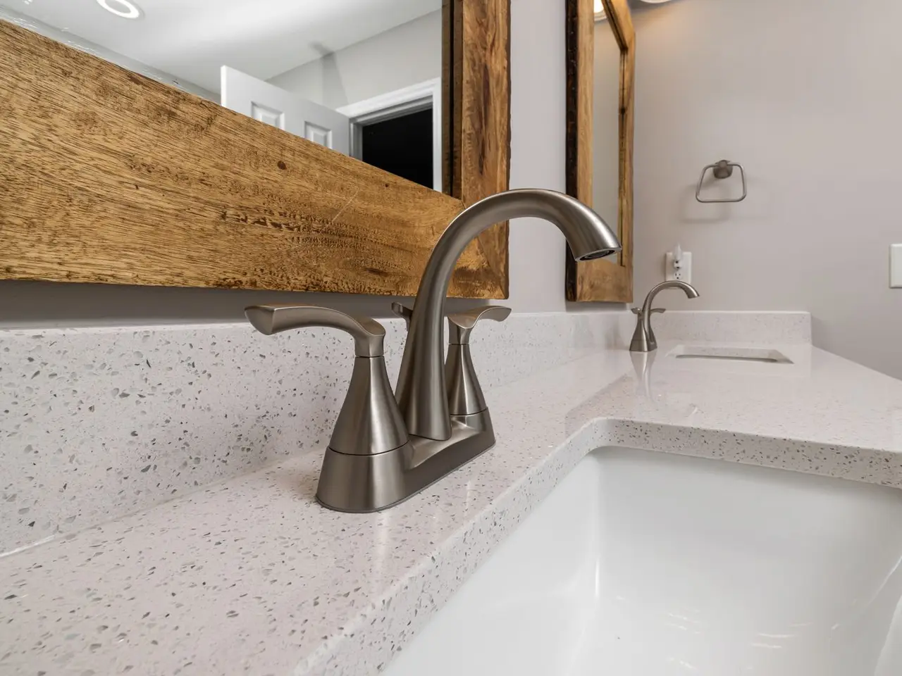 Example after: new vanity sink with a brushed faucet
